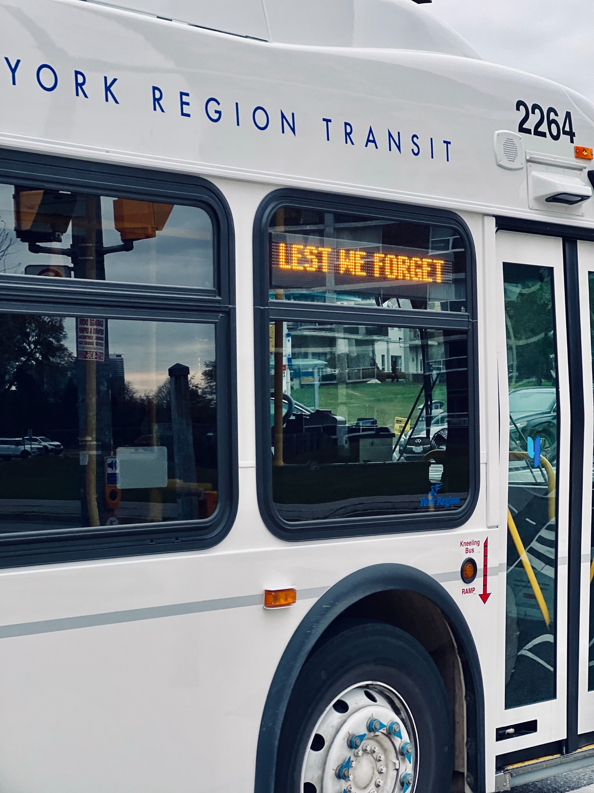 Lest we forget sign on YRT bus